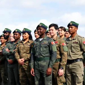Diverse military personnel standing together in uniform.
