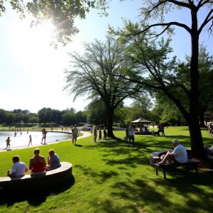 People enjoying shade in Bowling Green during extreme heat