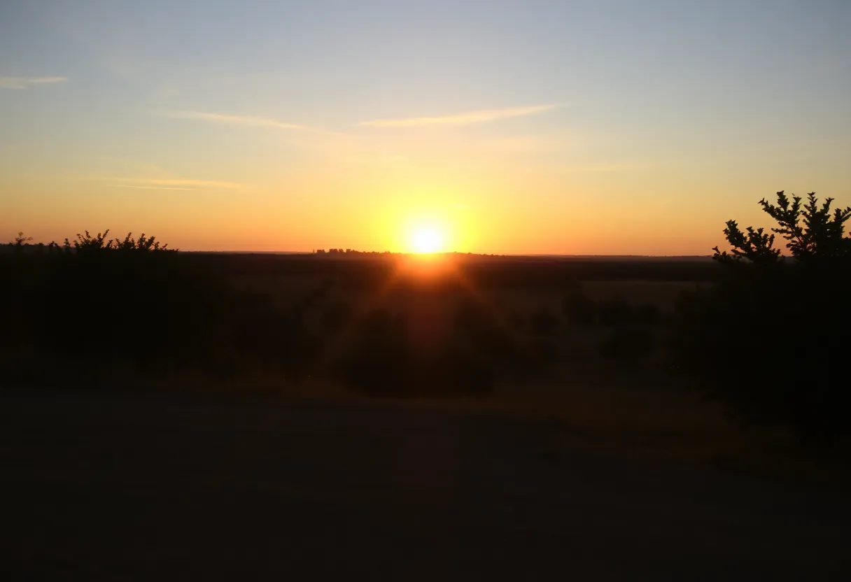 Sunset over a peaceful landscape symbolizing legacy and community remembrance.